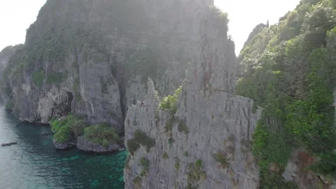 Aerial video flying back over the cliff of Koh Phi Phi Lee Stock Footage 241145606
