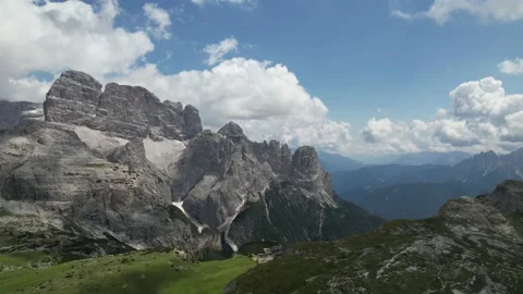 Aerial video flying forward over the Dolomites, Northern Italy during a sunny Stock Footage 237296515