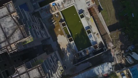 Aerial Video: High-Rise Construction With Workers Completing Concrete Floors and Stock Footage 342519161
