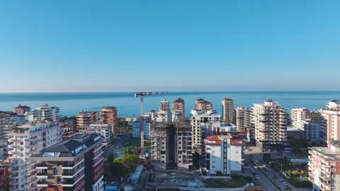 Aerial Video of a High-Rise Development With Cranes Moving Heavy Equipment and Stock Footage 301366648