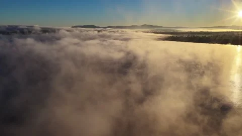 Aerial video of Lake Keepit Dam blanketed by morning fog Stock Footage 340522012