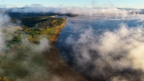 Aerial video of Lake Keepit Dam blanketed by morning fog Stock Footage 340522255