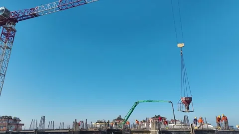 Aerial Video of a Large Construction Site With Workers Pouring Concrete and Stock Footage 301366007
