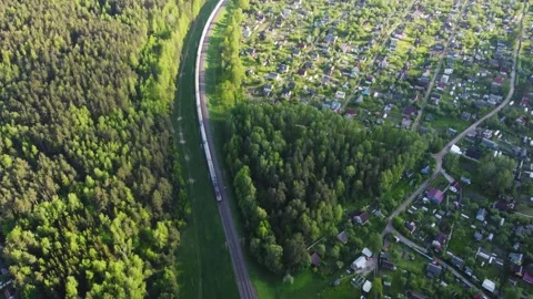 Aerial video of a local train passing by, driving through beautiful forest an 스톡 동영상 277199219