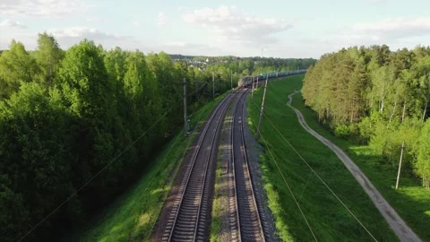 Aerial video of a local train passing by, driving through beautiful forest 스톡 동영상 277199265