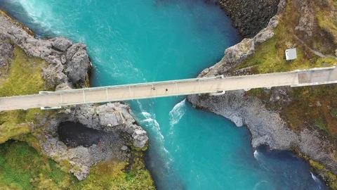 Aerial Video Looking Down on Bridge Over Vivid Blue River in Iceland Video stock 97751784