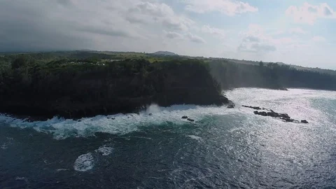 Aerial Video Maui slow motion approaching cliff with waves breaking Stock Footage