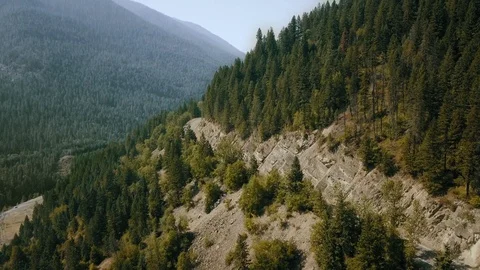 Aerial video of mountain drones with dense forest and sand clearance Montana Video stock 123392854