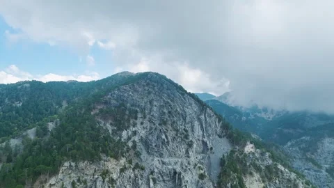 Aerial Video of Mountain Road Between Rocks and Pines Stock Footage 330658640