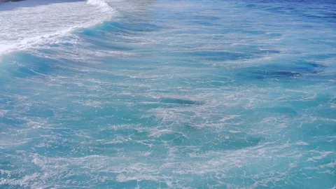 Aerial video of ocean waves at close range. Flying a drone over the waves.  Stock Footage 127590317