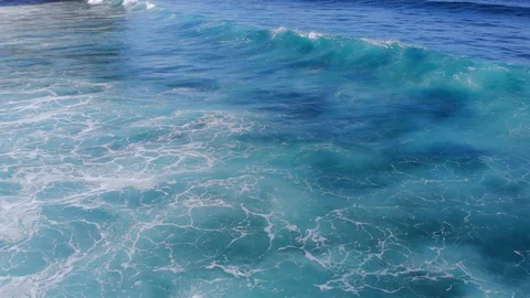 Aerial video of ocean waves at close range. Flying a drone over the waves.  Stock Footage 127590321