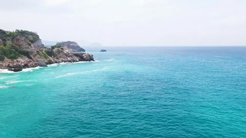Aerial Video Ocean Waves Rolling Toward Rocky Mediterranean Coast Stock Footage 341074293