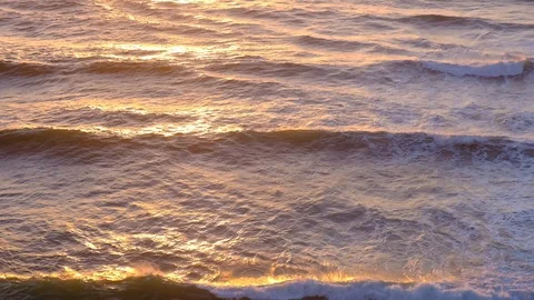 Aerial video of ocean waves surface at sunset. Aerial view of ocean waves at  Stock Footage 108097134