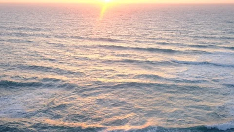 Aerial video of ocean waves surface at sunset. Aerial view of ocean waves at  Video stock 108097148