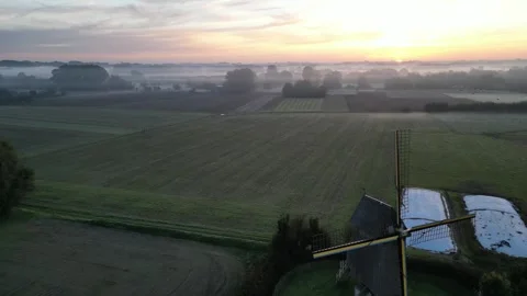 Aerial video of an old windmill during sunrise Stock Footage 243127285