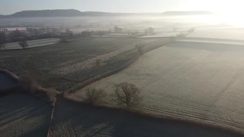 Aerial video over the green fields with heavy fog in Newport UK Stock Footage 280924561