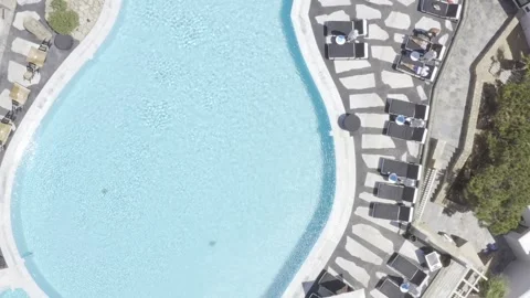 Aerial video over a pool of one of the myconian collection hotels, Mykonos, Stock Footage 271105037