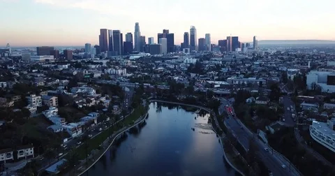 Aerial Video Panning Down towards Reservoir with Los Angeles Skyline in the Back Stock Footage