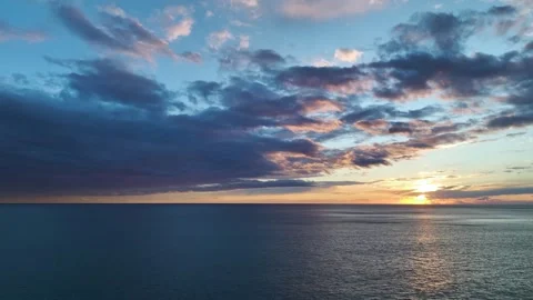 Aerial Video of Romantic Evening Sky Painted in Pastel Colors Above Calm Blue Stock Footage 342815424