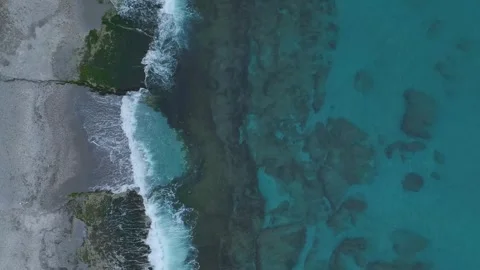 Aerial Video of a Sandy Beach With Tiny Shells and Ocean Foam Creating a Natural Stockbeeldmateriaal 301371746