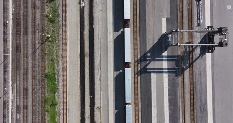 Aerial video of several, many, parallel railroad tracks in a rail yard. Stock-Footage 317843517