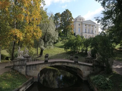 Aerial video of the Slavyanka River, the Centaur Bridge and the Pavlovsk Palace Stock Footage 80482233