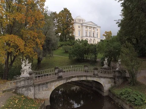 Aerial video of the Slavyanka River, the Centaur Bridge and the Pavlovsk Palace Stock Footage 80659929