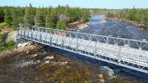 Aerial Video of Small River and Overarching Bridge Video stock 253265341