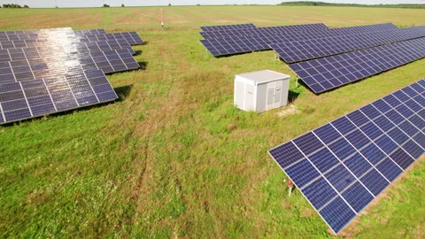 Aerial video of solar modules aligned in broad countryside area Stock Footage 346708477