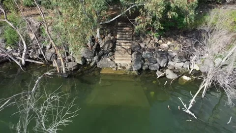 Aerial video of stairs going down into the Sea of Galilee Stock Footage 247653665