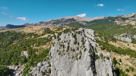 Aerial Video of Steep Rock Surrounded by Countryside Stock Footage 334116839