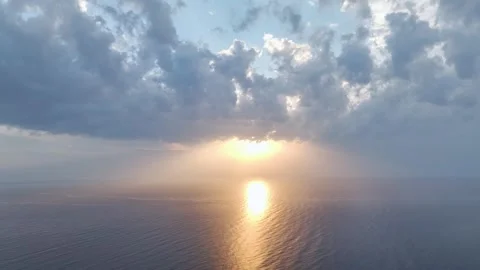 Aerial Video: Stunning cloud reflections on the Mediterranean Sea under a golden Stock Footage 300897088