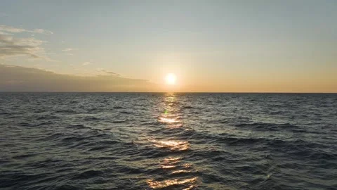 Aerial Video Sunset Rays Reflecting on the Textured Sea Surface Creating a Stock Footage 301004888