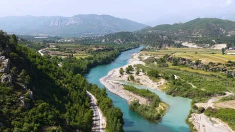 Aerial Video of Sunset River Through Lush Farmland, Gardens, Greenhouses and Video stock 343733306