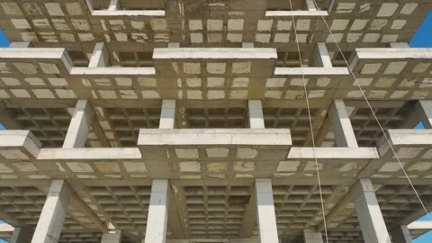 Aerial Video of a Tall Structure Under Construction With a Scaffolding-Covered Stock-Footage 301370077