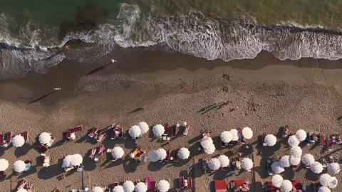 Aerial Video Top View of Beach with Umbrellas and Sunbathing Tourists Stock Footage 341251404