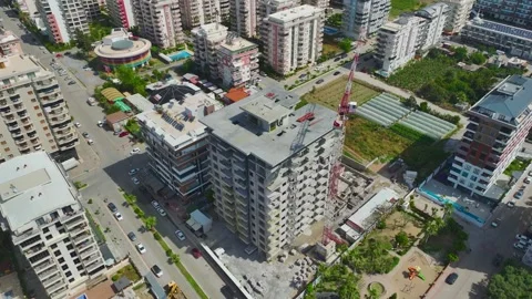 Aerial Video of Tower Crane Operating in Urban Build Zone Stock Footage 343318368