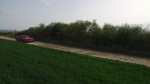 Aerial Video with Tracking Tracks OF RED MUSTANG MUSCLE  Video stock 116123706