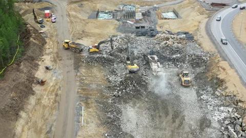 Aerial video of two excavators work at road cons, UMEA,SWEDEN - JULY 09, 2020 Stock Footage 194972613