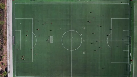 Aerial video Two teams playing ball in outdoor football, top view. Outdoor 스톡 동영상 199646572