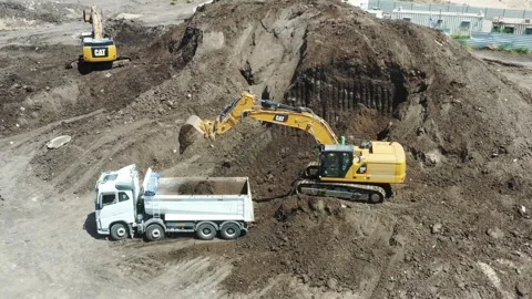 Aerial video of work in the construction area of heavy machinery in motion Stock Footage 241780242