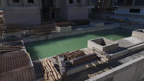 Aerial Video: Workers and Cranes Building Structures and Pouring Concrete on a 库存影片 342500232