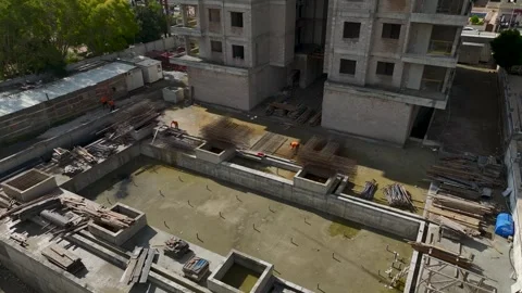 Aerial Video of Workers in Orange Uniforms at Build Zone Stock Footage 343327803
