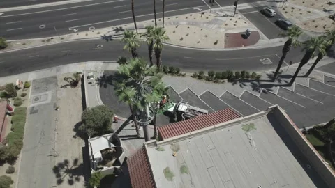 Aerial video of workers servicing cell tower Stock Footage 246948874