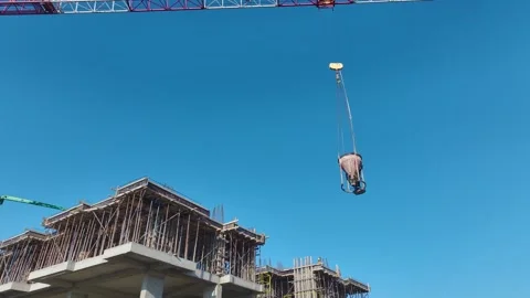 Aerial Video of Workers Spreading Concrete Using Hand Tools Stock Footage 343566154