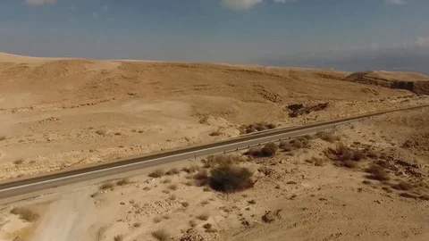 Aerial video.Road to the Dead Sea.through the mountains and desert. Stockbeeldmateriaal 83878229