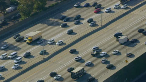 Aerial view of 110 Highway traffic on a sunny day in Los Angeles, California. Sh Stock Footage 199463395