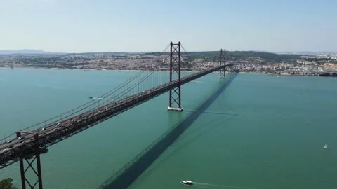 An aerial view of the 25 de Abril Bridge across the Tagus river Stock Footage 202015262