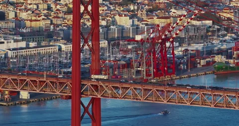 Aerial view of 25 de Abril bridge over the Tagus River at sunset in Lisbon Stock-Footage 308961896