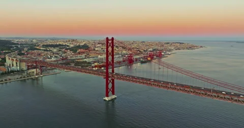 Aerial view of 25 de Abril bridge over the Tagus River at sunset in Lisbon 스톡 동영상 311501511